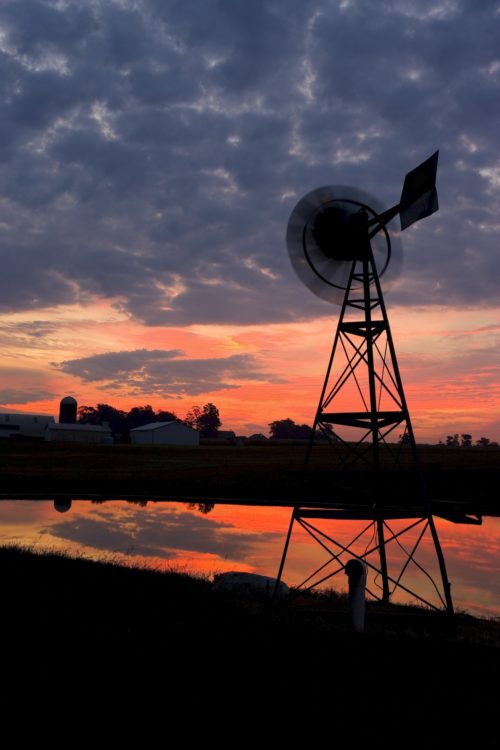 Old windmill overlooking farmland